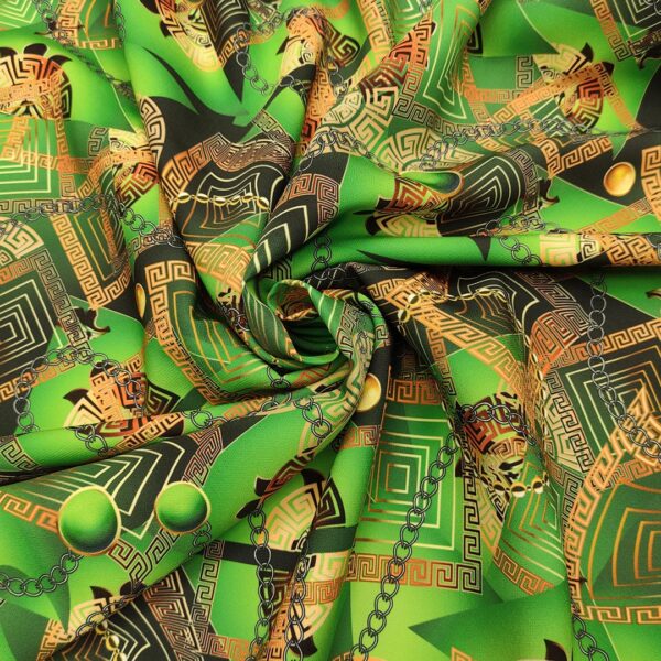 Tessuto Cady elasticizzato a fantasia motivo floreale barocco verde prato - nero - oro