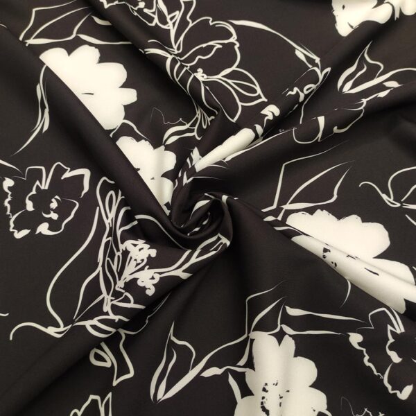 Tessuto Cady elasticizzato a fantasia motivo floreale nero - bianco