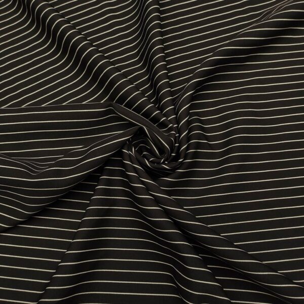 Tessuto Cady elasticizzato a fantasia motivo rigato nero - bianco