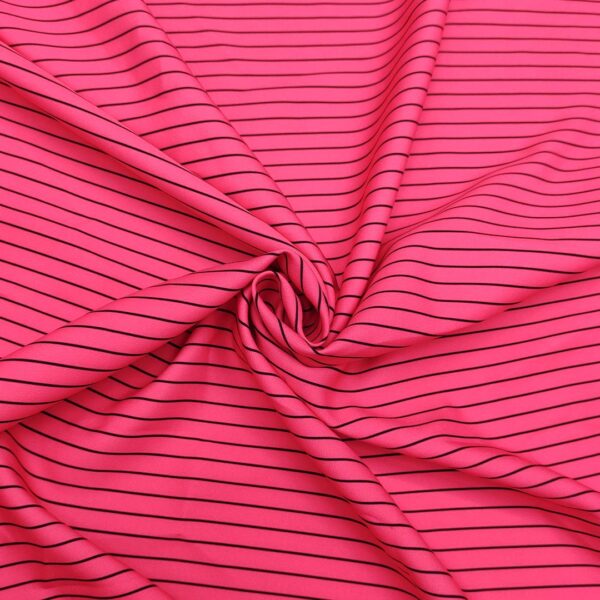 Tessuto Cady elasticizzato a fantasia motivo rigato rosa fluo - nero