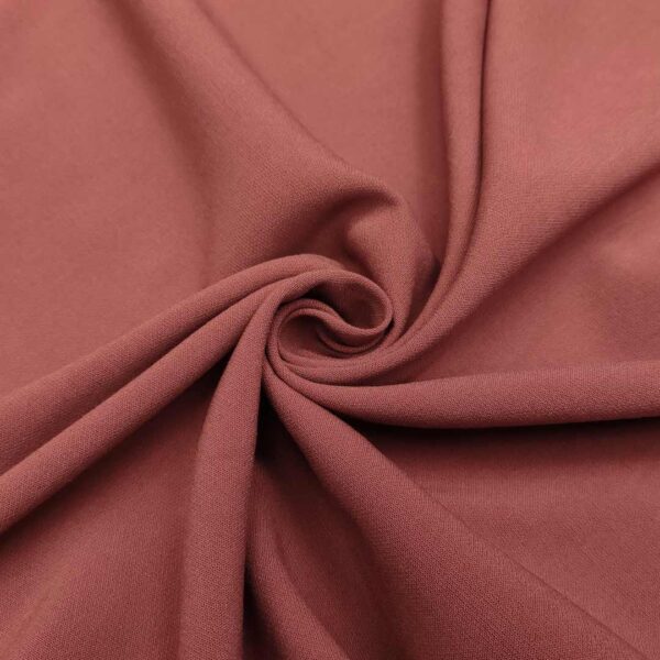Tessuto Crepe morbido peso autunnale in tinta unita rosa antico