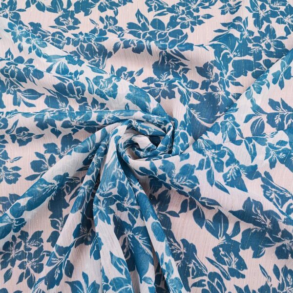 Tessuto Chiffon a fantasia con filo lurex motivo floreale ottanio - panna