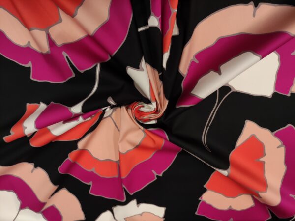 Tessuto Cotone a fantasia motivo astratto nero - fucsia