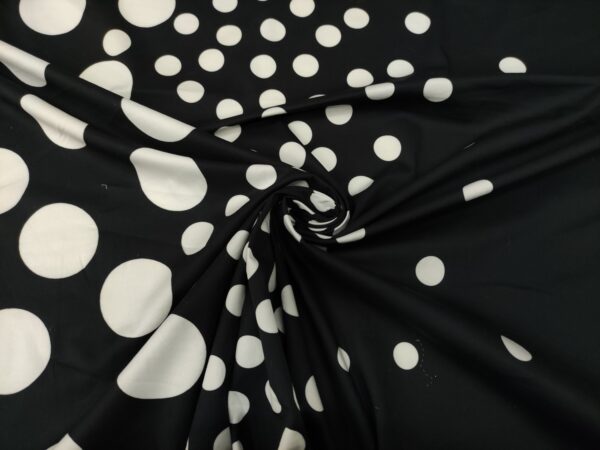 Tessuto Cotone a fantasia motivo pois bianco - nero