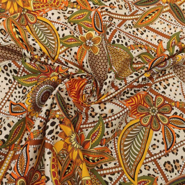 Tessuto Cotone e Lino a fantasia motivo etnico arancione - verde - ocra