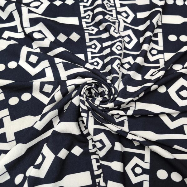 Tessuto Crepe a fantasia motivo astratto blu notte - bianco