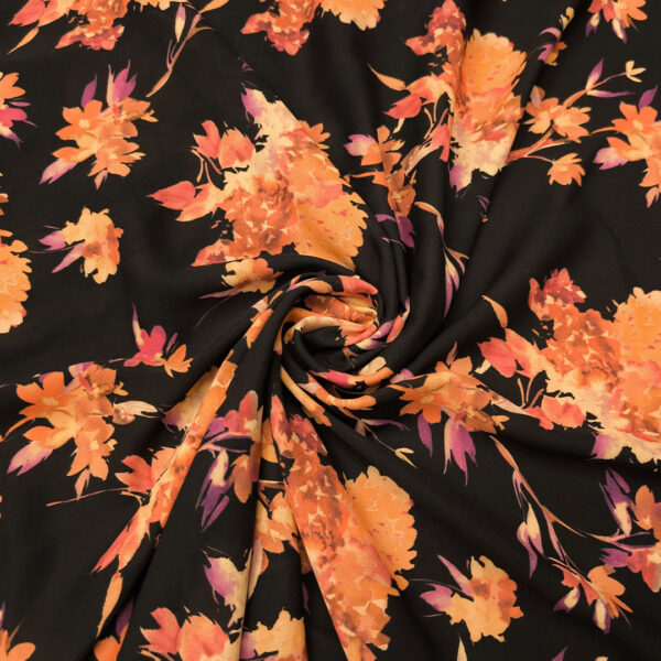Tessuto Crepe a fantasia motivo floreale amaranto - arancio - orchidea