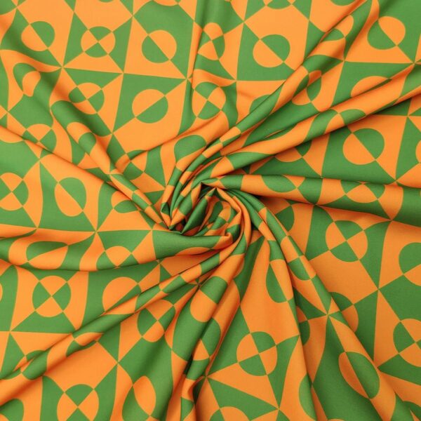Tessuto Crepe a fantasia motivo geometrico verde prato - arancione
