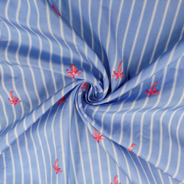 Tessuto Crepe a fantasia ricamato con paillettes motivo rigato azzurro - bianco - arancione