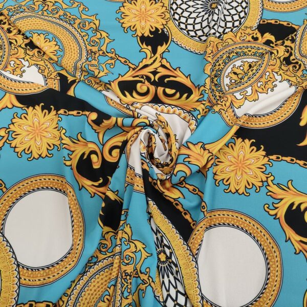 Tessuto Crepe a fantasia motivo floreale barocco celeste - ocra - nero