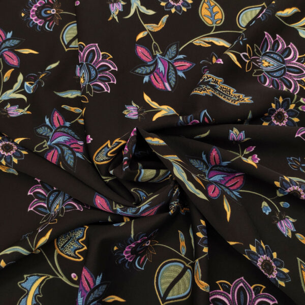 Tessuto Crepe elasticizzato a fantasia motivo floreale nero - viola - giallo