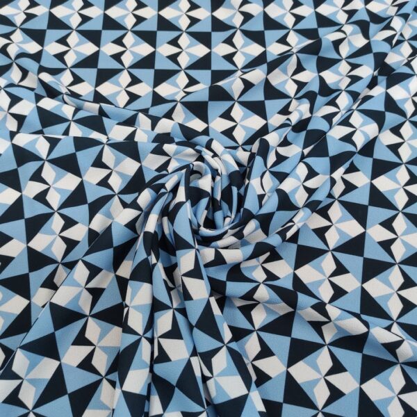 Tessuto Crepe a fantasia motivo geometrico celeste - bianco - blu