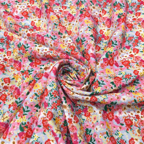 Tessuto Crepe elasticizzato a fantasia motivo floreale rosso - giallo - verde