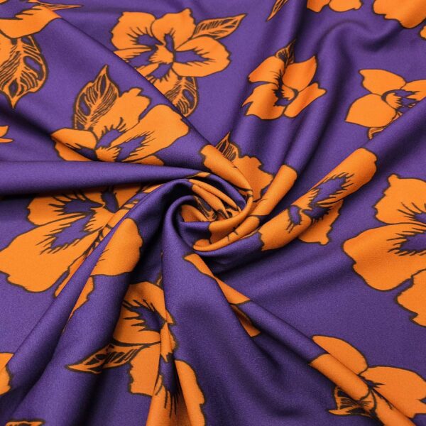 Tessuto Crepe elasticizzato a fantasia motivo floreale viola - arancione