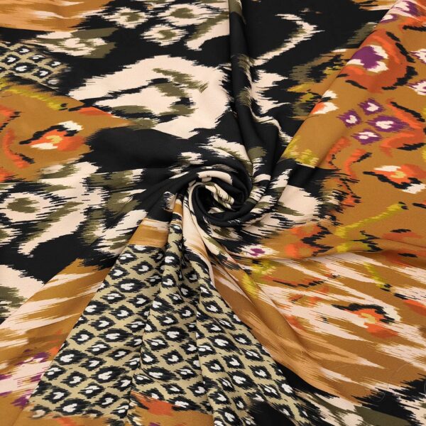 Tessuto Crepe a fantasia motivo etnico - coccio - panna - nero