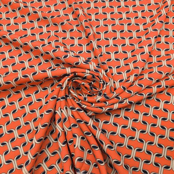 Tessuto Crepe a fantasia motivo geometrico arancione - beige - nero
