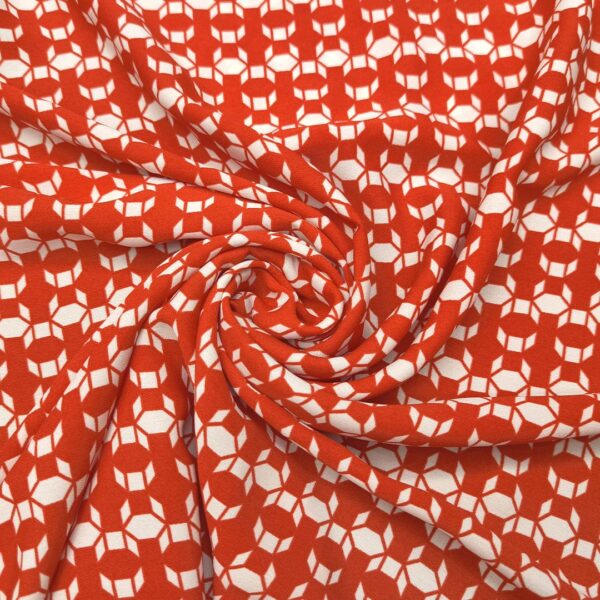 Tessuto Crepe a fantasia motivo geometrico rosso - bianco