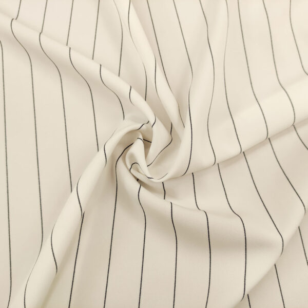 Tessuto Crepe elegance elasticizzato a fantasia motivo rigato bianco - nero