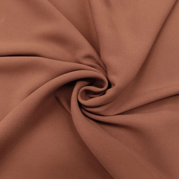 Tessuto Crepe morbido in tinta unita rosa antico scuro