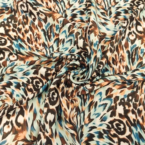 Tessuto Crepe a fantasia motivo animalier celeste - verde ottanio - marrone - beige