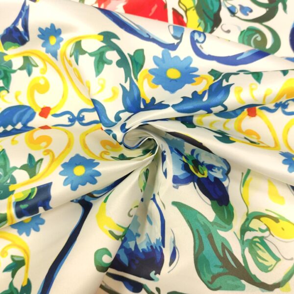 Tessuto Duchesse a fantasia motivo astratto giallo - blu elettrico - bianco - rosso - verde