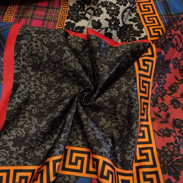 Tessuto Duchesse a fantasia motivo astratto rosso - arancione - blu elettrico