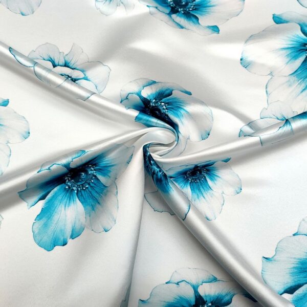 Tessuto Duchesse a fantasia motivo floreale bianco - turchese
