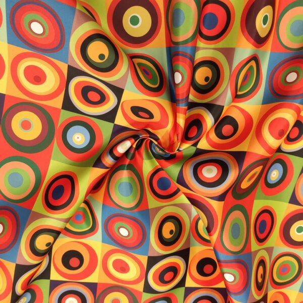 Tessuto Duchesse a fantasia motivo geometrico celeste - rosso - giallo - verde - arancione