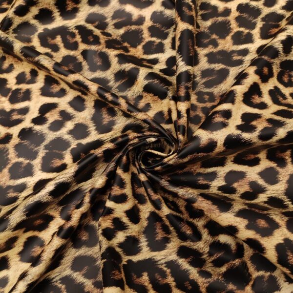 Tessuto ecopelle a fantasia motivo animalier beige - nero
