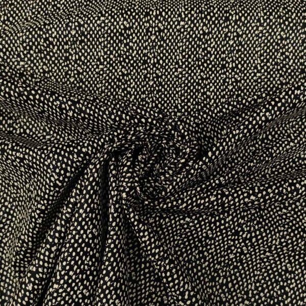 Tessuto ecopelle a fantasia motivo astratto bianco - nero