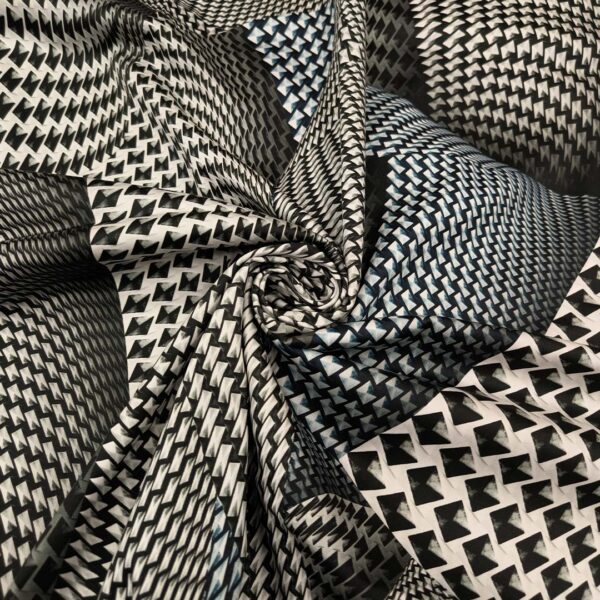 Tessuto Gabardine di Cotone a fantasia motivo astratto nero - panna - carta da zucchero