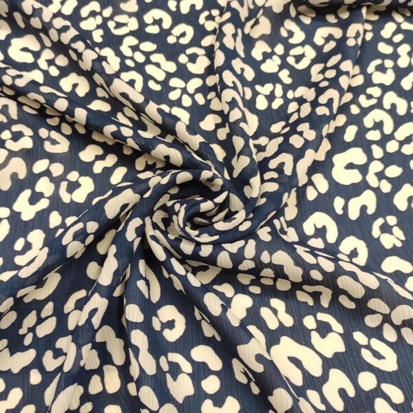 Tessuto Georgette a fantasia motivo animalier bianco - blu