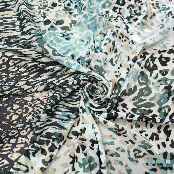 Tessuto Georgette a fantasia motivo animalier tiffany - panna - nero