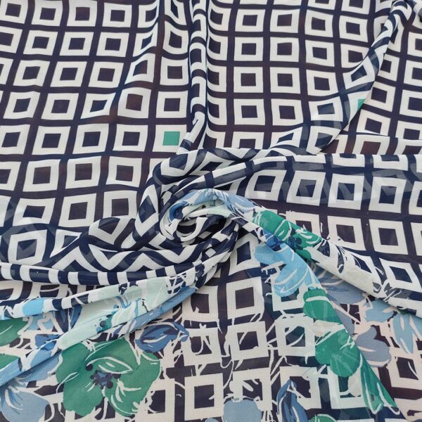 Tessuto Georgette a fantasia motivo astratto bianco - blu - verde smeraldo