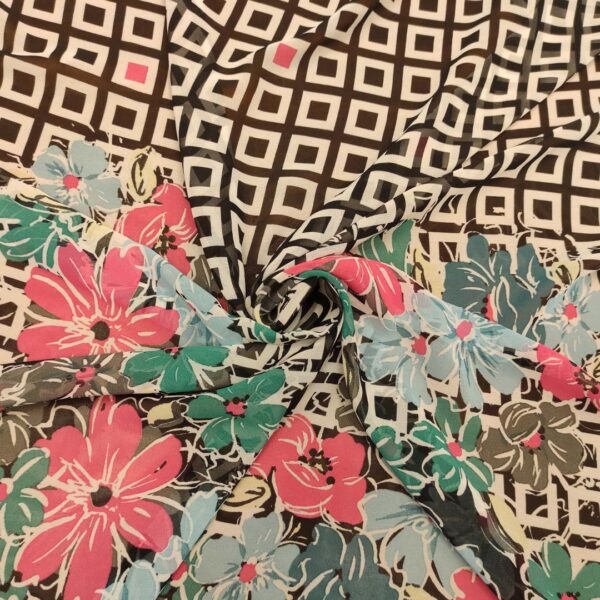 Tessuto Georgette a fantasia motivo astratto bianco - nero - fucsia - verde