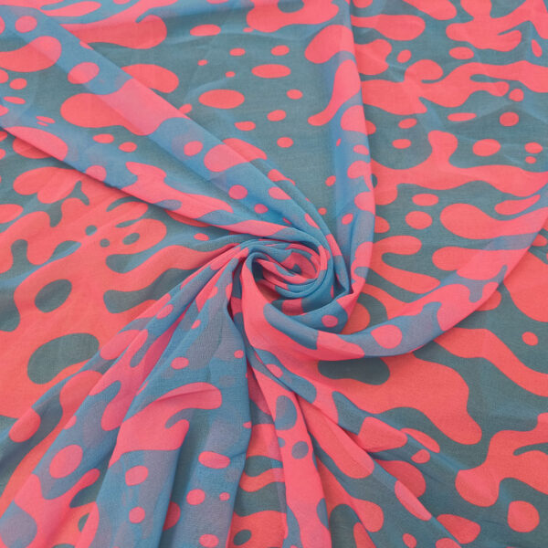 Tessuto Georgette a fantasia motivo astratto celeste - fucsia