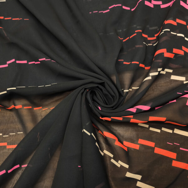 Tessuto Georgette a fantasia motivo astratto nero - corallo - fucsia