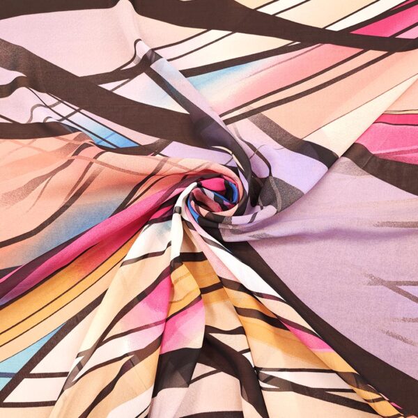 Tessuto Georgette a fantasia motivo astratto nero - lilla - celeste - fucsia