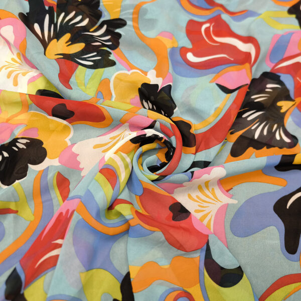Tessuto Georgette a fantasia motivo astratto turchese - nero - rosso - giallo