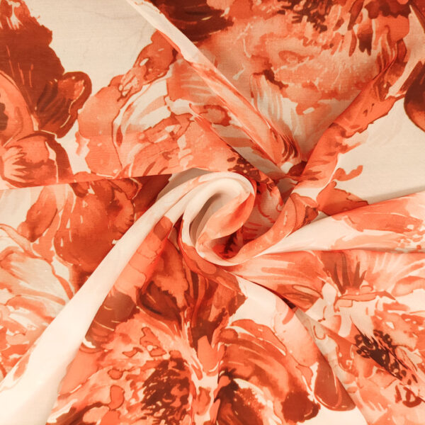 Tessuto Georgette a fantasia motivo floreale bianco - arancio
