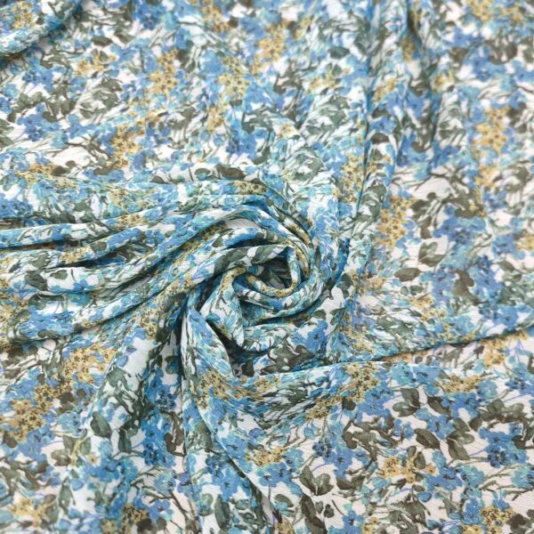 Tessuto Georgette a fantasia motivo floreale turchese - giallo - bianco