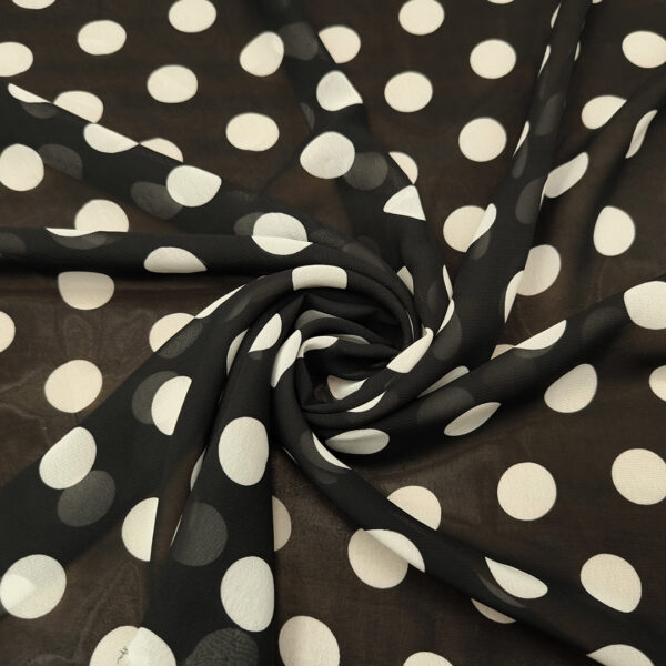 Tessuto Georgette a fantasia motivo pois grandi nero - bianco