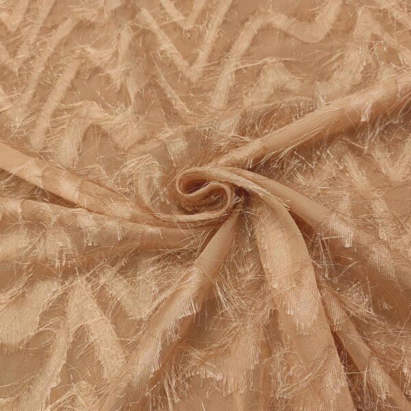 Tessuto Georgette con frange motivo geometrico rosa cipria