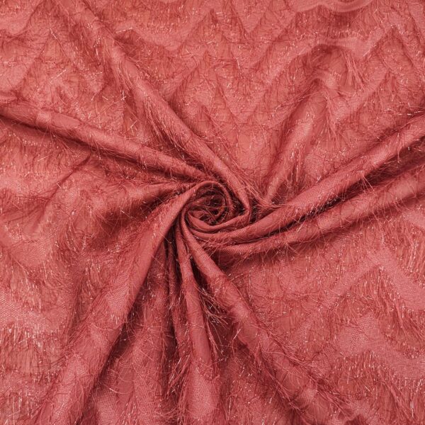 Tessuto Georgette con frange motivo geometrico rosa geranio