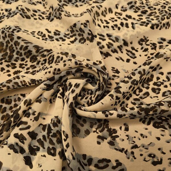 Tessuto Georgette a fantasia motivo animalier celeste - beige - nero