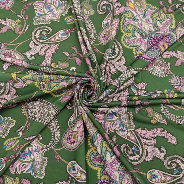 Tessuto jersey a fantasia motivo etnico verde prato - rosa