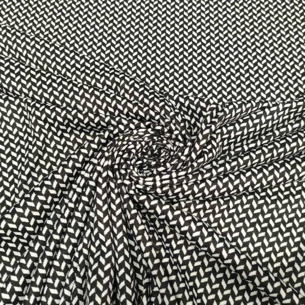 Tessuto jersey peso autunnale a fantasia motivo geometrico nero - bianco