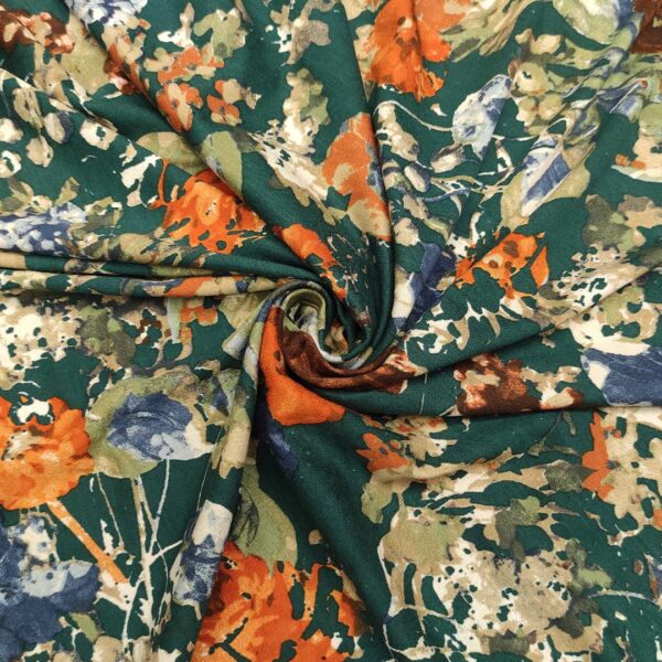 Tessuto Jersey di viscosa a fantasia motivo floreale verde petrolio - arancio - blu