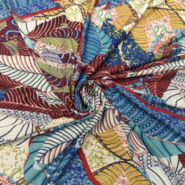Tessuto Jersey a fantasia motivo astratto bordeaux - tiffany - blu navy - ocra