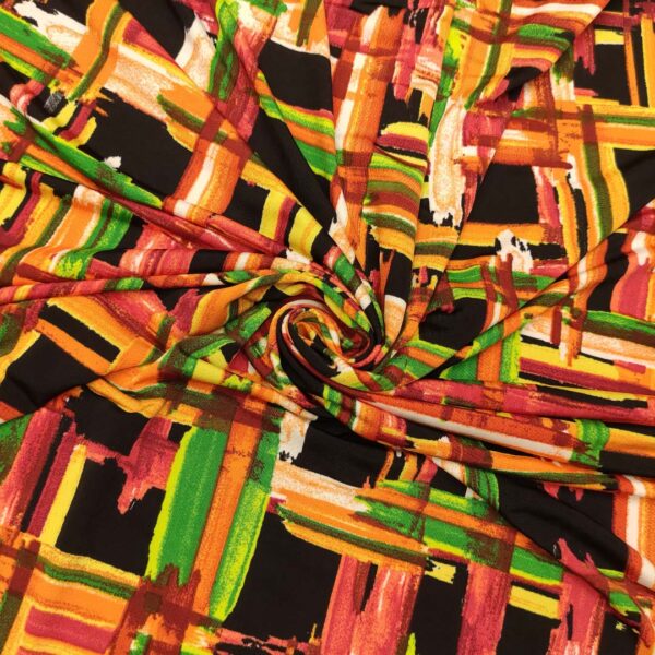 Tessuto Jersey a fantasia motivo astratto nero - arancione - verde